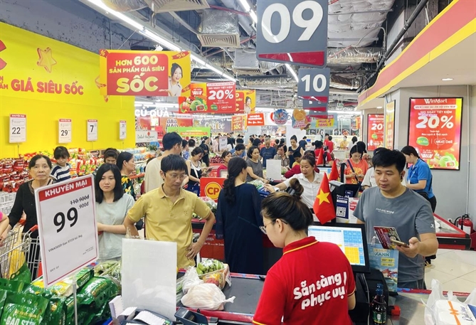 Customers shop at a WinMart supermarket. Photo courtesy of Masan.